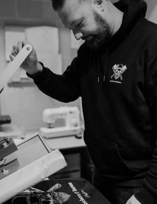 Maarten from Butchers & Barons printing shirts in the studio