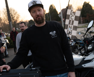 Maarten from Butchers & Barons posing in front of his motorcycle at Motoccino Zandhoven