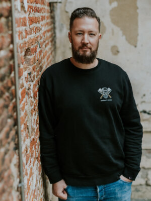 Loyalty black sweater by Butchers & Barons with skull, beard and monocle.